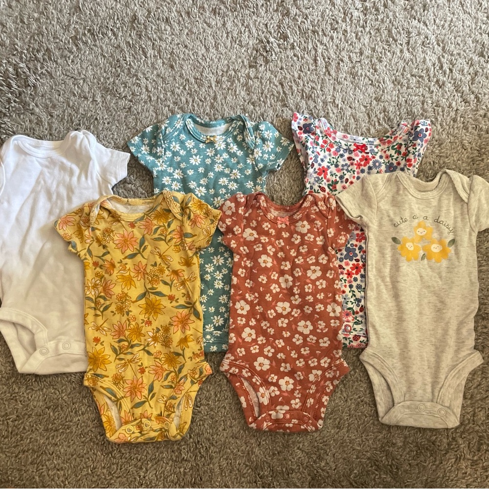Six Floral and Solid Newborn Onesies